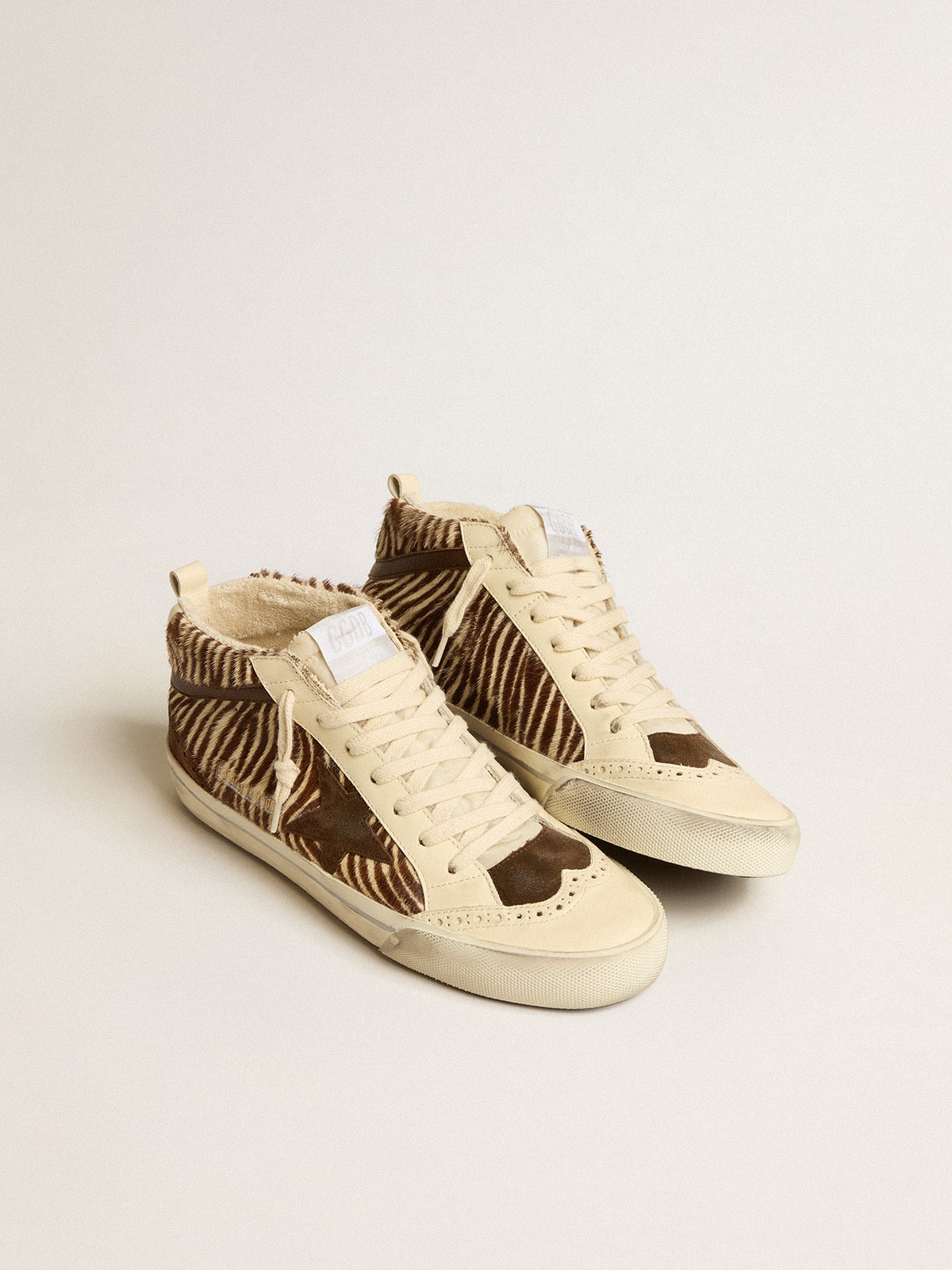 Mid Star LTD en piel de potro con estampado de cebra, estrella de ante y destellos marrones