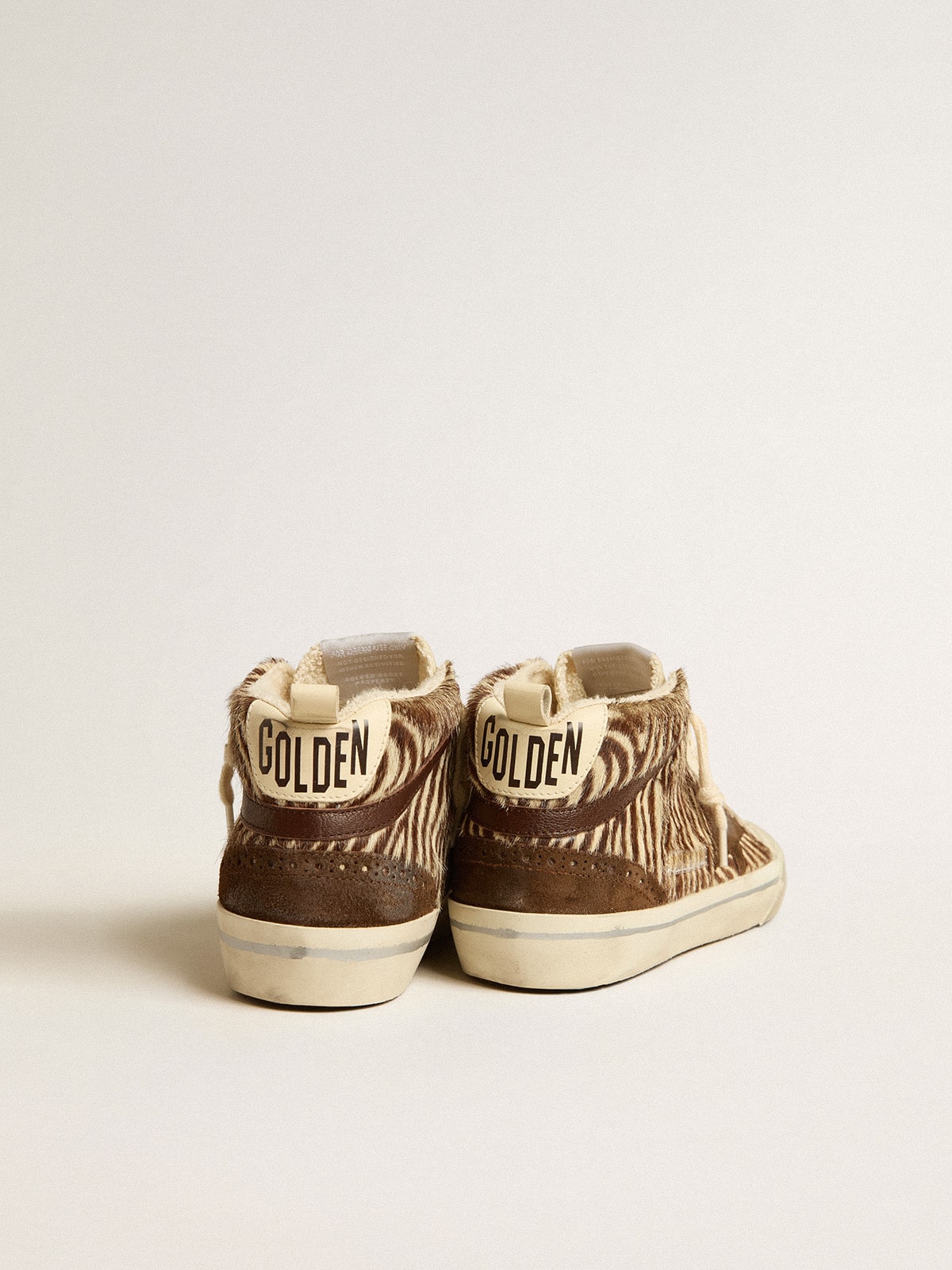 Mid Star LTD en piel de potro con estampado de cebra, estrella de ante y destellos marrones